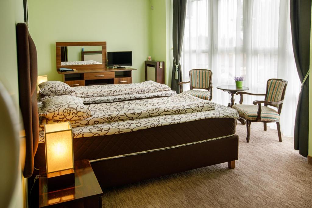 Postel nebo postele na pokoji v ubytování Villa Modena