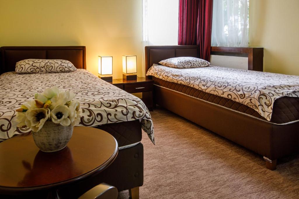 Postel nebo postele na pokoji v ubytování Villa Modena