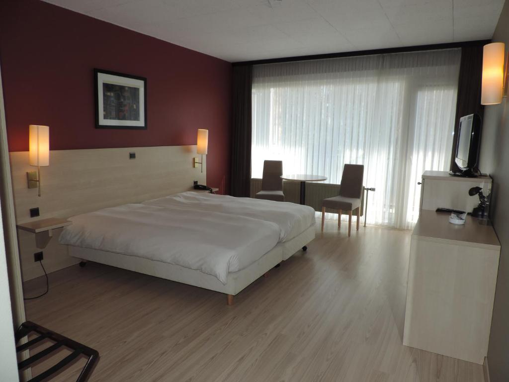 Voodi või voodid majutusasutuse Hotel Panorama toas