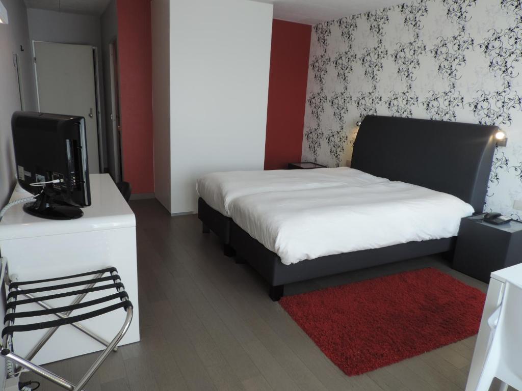Voodi või voodid majutusasutuse Hotel Panorama toas