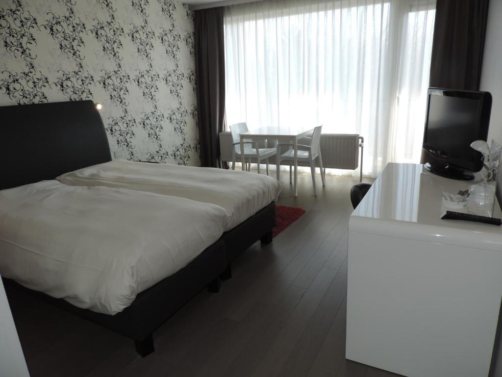 Voodi või voodid majutusasutuse Hotel Panorama toas