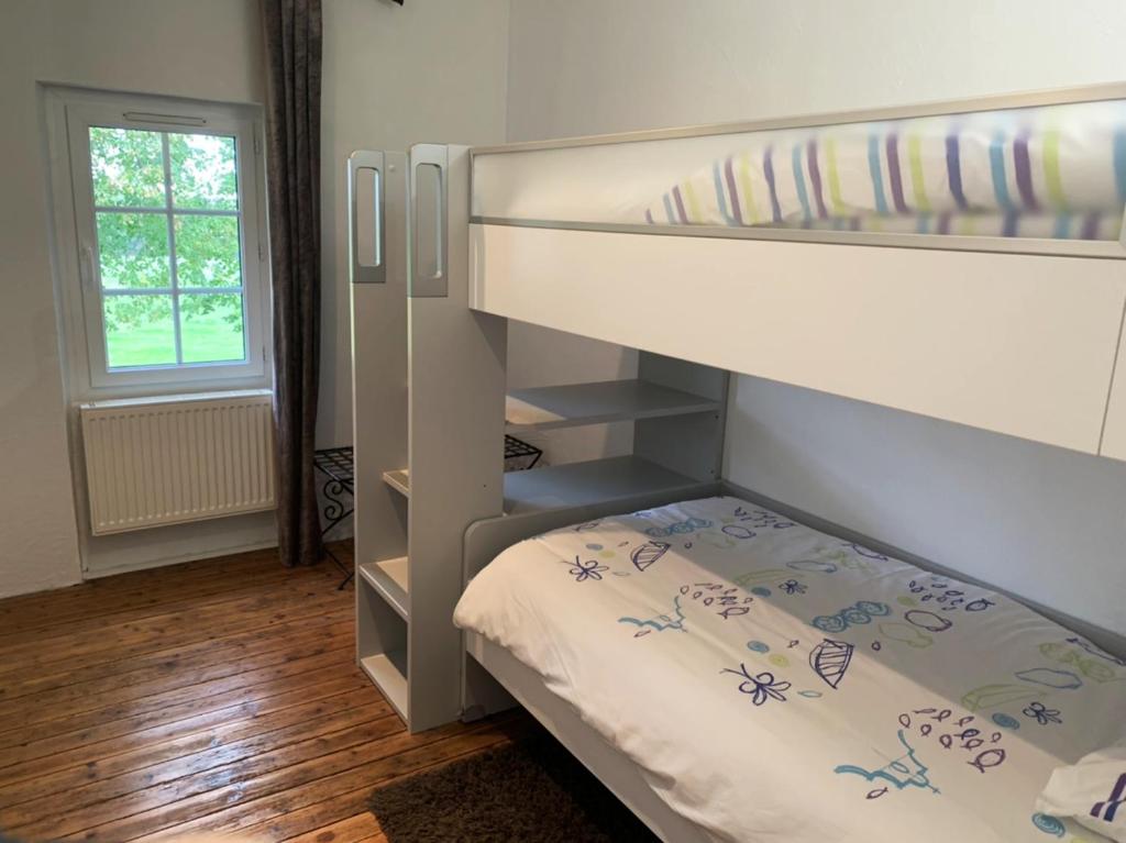 Postel nebo postele na pokoji v ubytování La Part des Anges