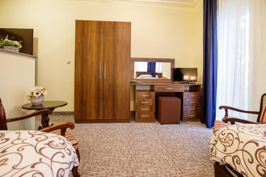 Postel nebo postele na pokoji v ubytování Villa Modena
