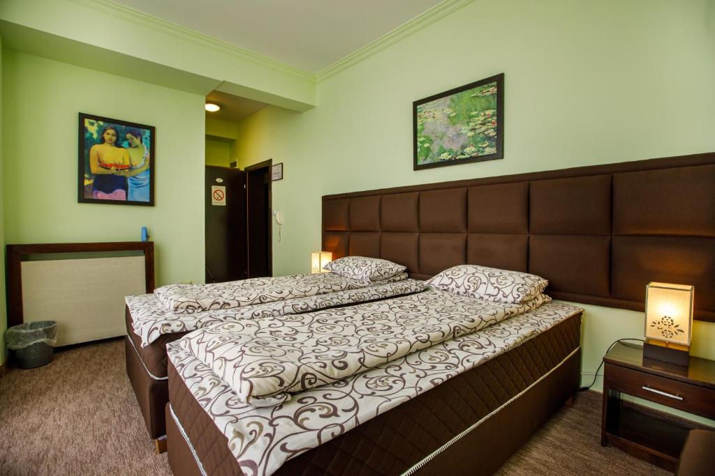 Postel nebo postele na pokoji v ubytování Villa Modena