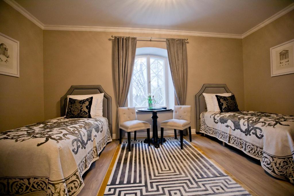 Postel nebo postele na pokoji v ubytování Schloss Fall, Keila-Joa