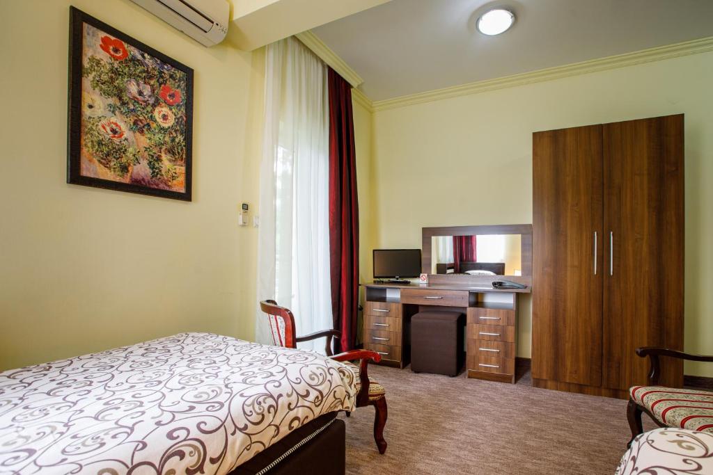 Postel nebo postele na pokoji v ubytování Villa Modena