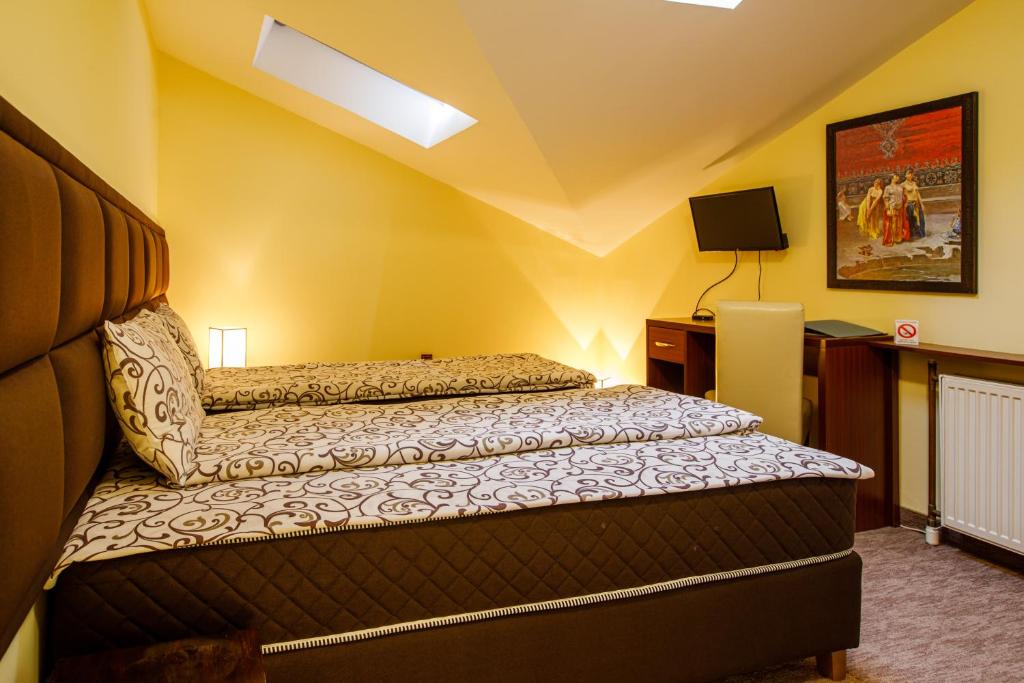 Postel nebo postele na pokoji v ubytování Villa Modena