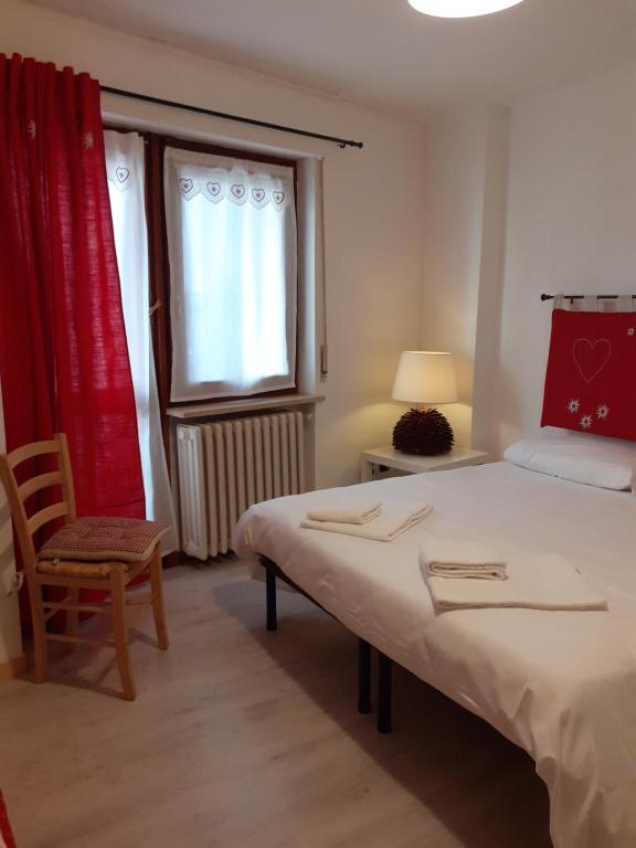 Posteľ alebo postele v izbe v ubytovaní La Casetta Del Dahu