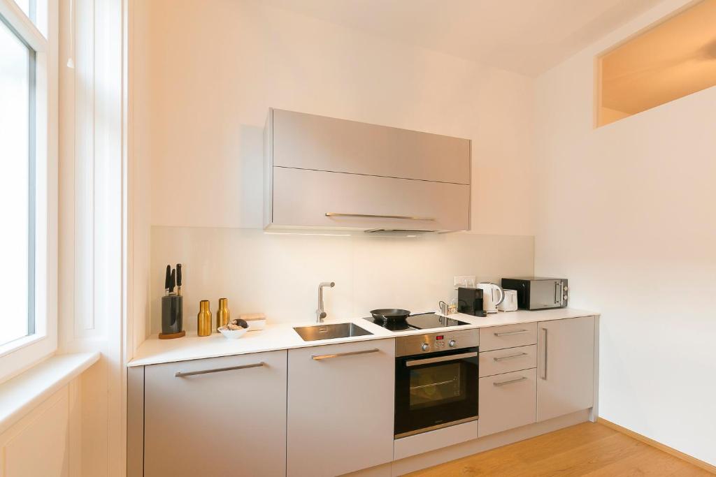 Kuchyň nebo kuchyňský kout v ubytování Mint@Naschmarkt Premium Apartments