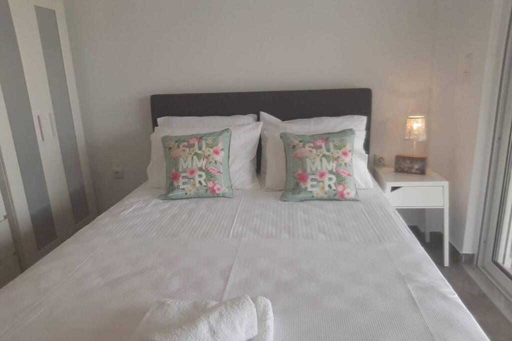 Postel nebo postele na pokoji v ubytování Apollo Romantic Sea View Villa
