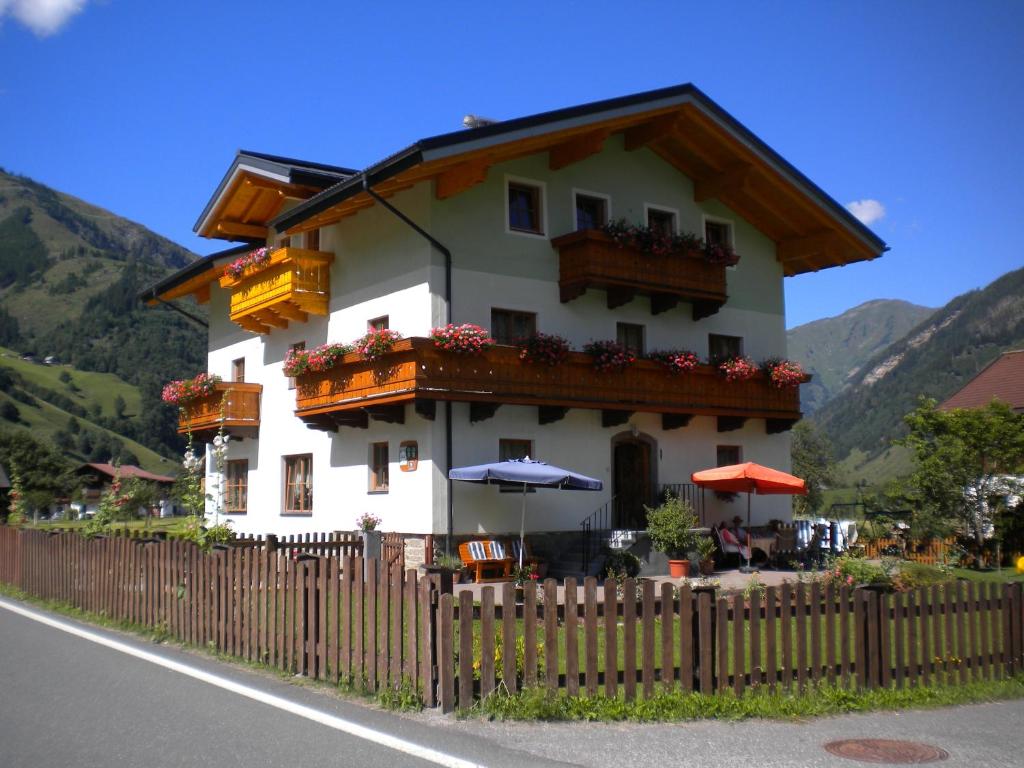 a building with a fence in front of it at Haus Helene in Rauris