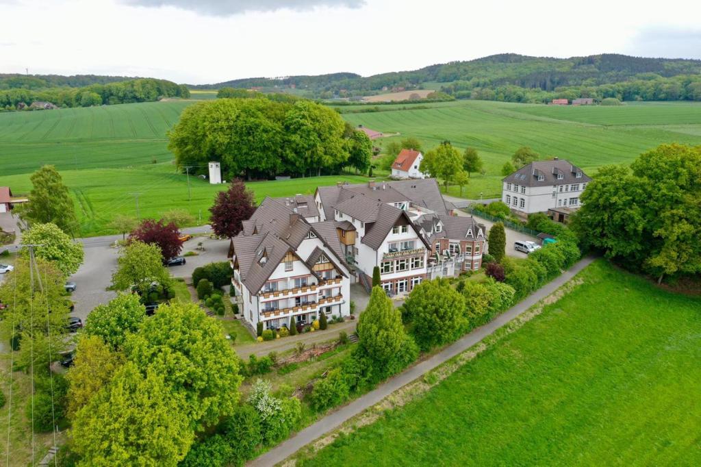 an aerial view of a large house with a yard at Landhotel Buller in Hagen