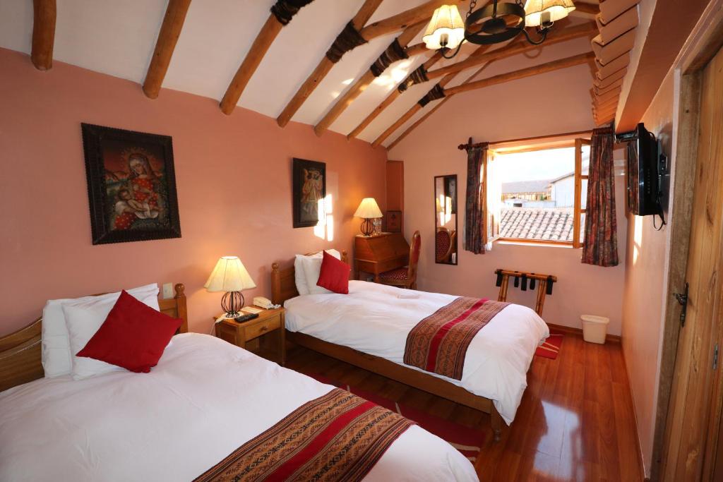 Katil atau katil-katil dalam bilik di Hotel & Mirador Los Apus