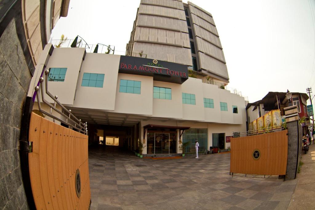 a building with a sign on the front of it at Paramount Tower in Kozhikode