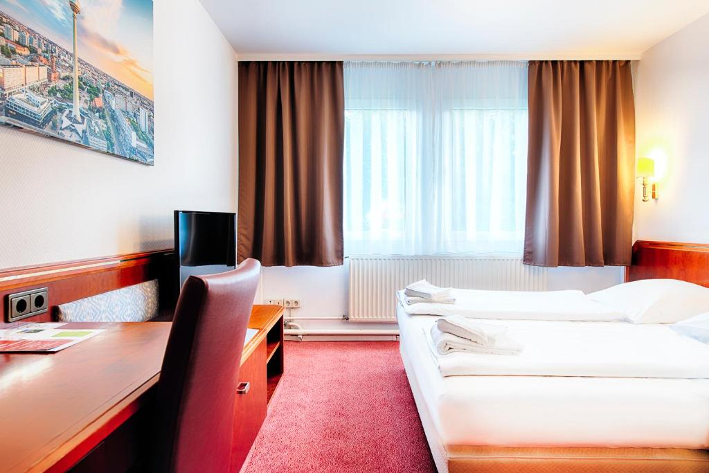 Postel nebo postele na pokoji v ubytování Hotel B1