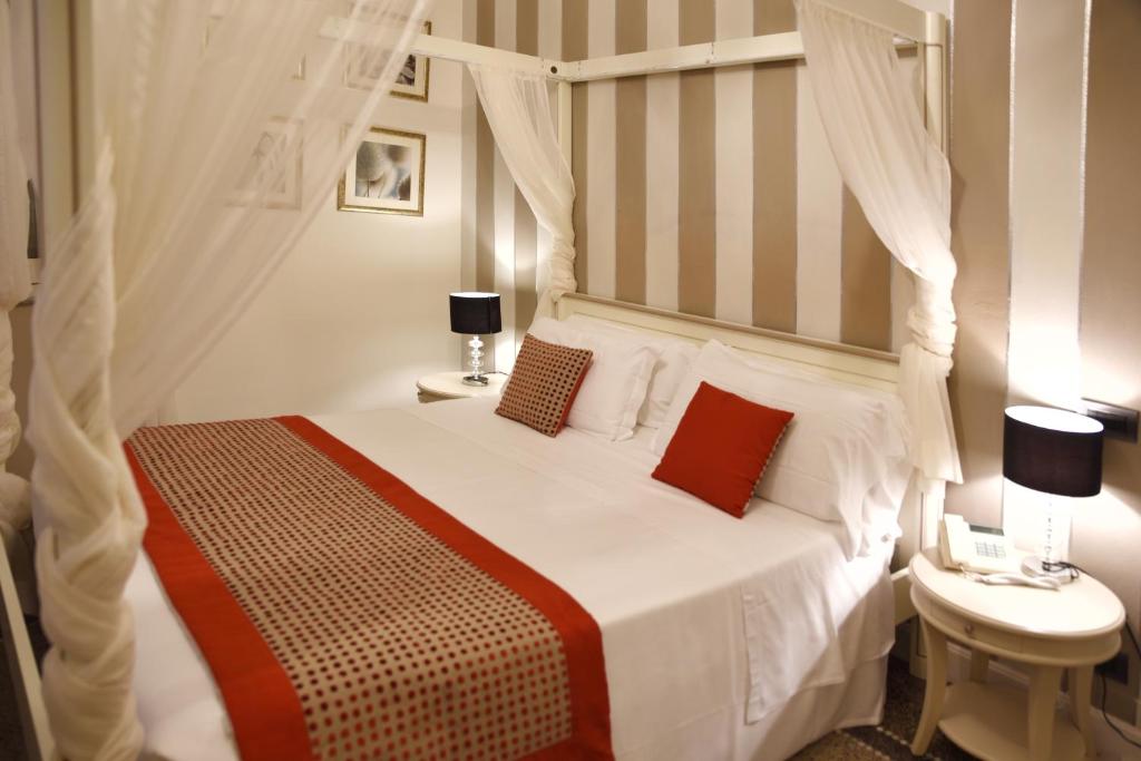 Postel nebo postele na pokoji v ubytování Hotel Sant'Andrea