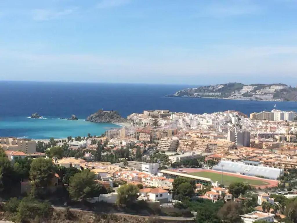 an aerial view of a city and the ocean at Seaview and sun all day long in Los Pinos, Almuñecar, Andalusia in Almuñécar