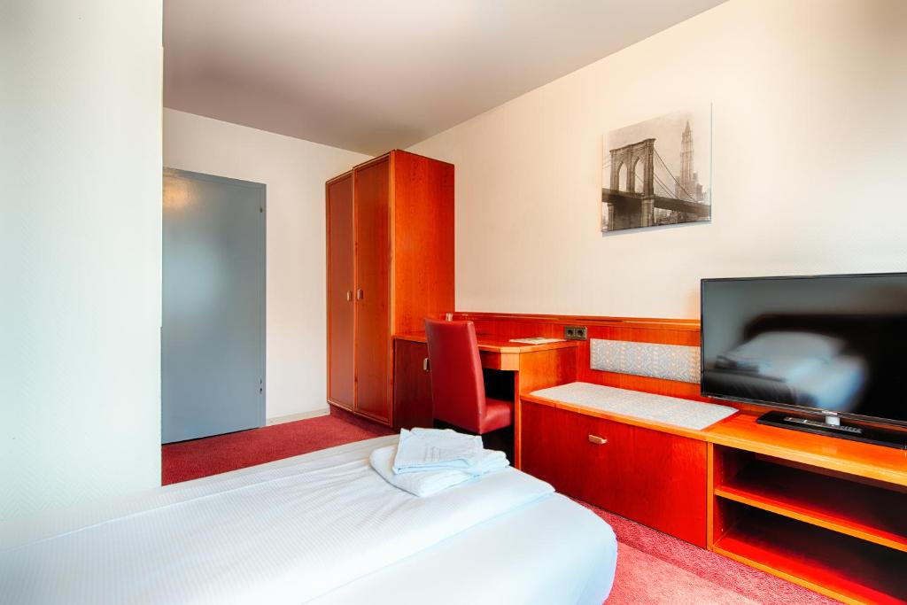 Postel nebo postele na pokoji v ubytování Hotel B1