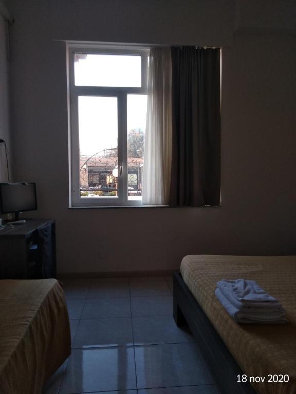 Postel nebo postele na pokoji v ubytování Hotel Virgilio