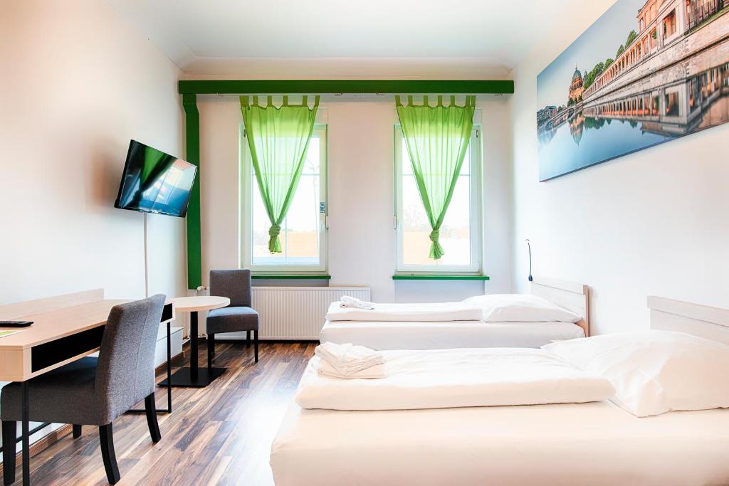 Postel nebo postele na pokoji v ubytování Hotel B1