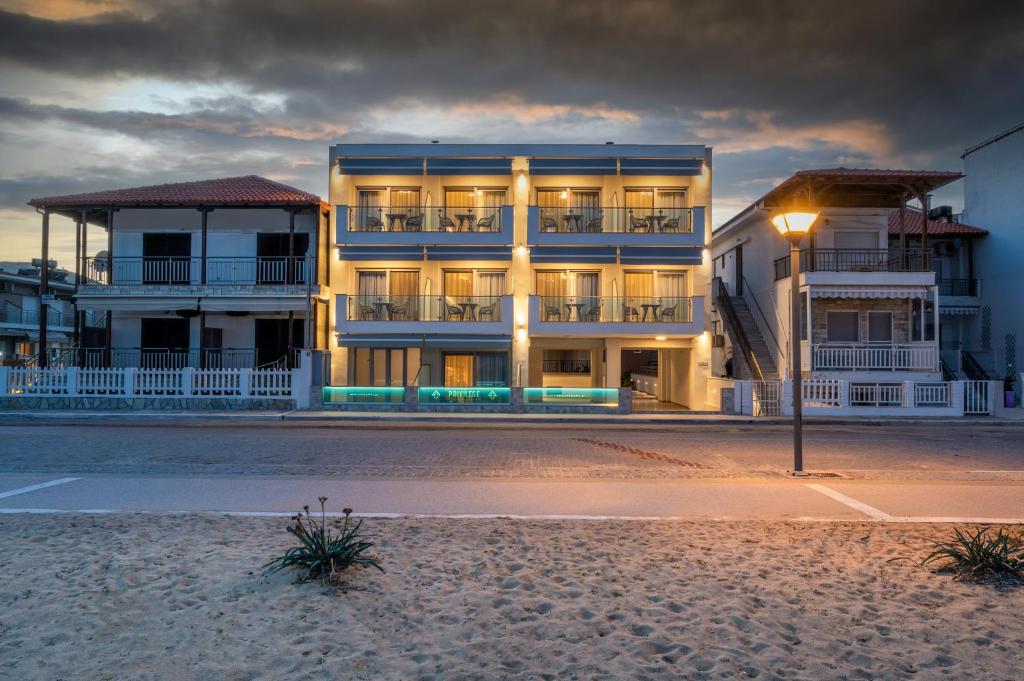 a building on the beach with a street light at Privilege Luxury Living in Sarti