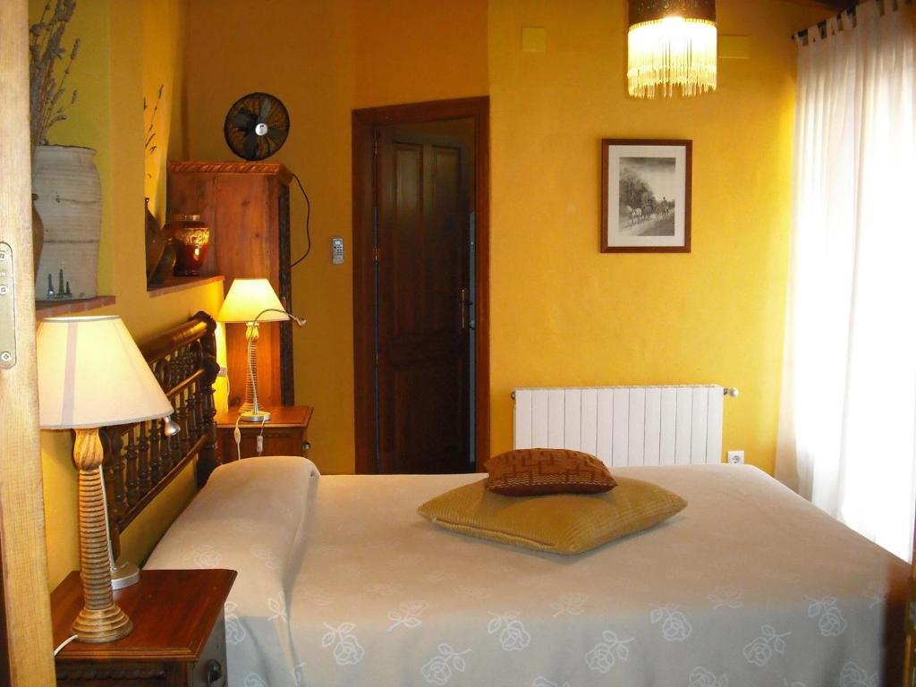 Postel nebo postele na pokoji v ubytování Casa Gallinera