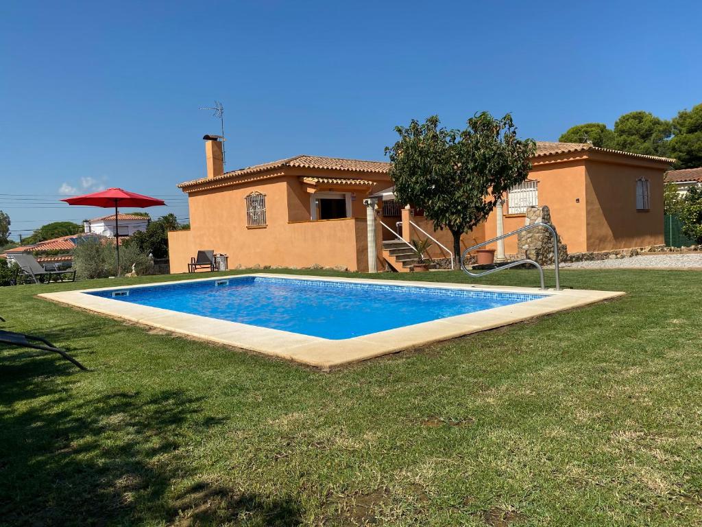 a swimming pool in front of a house at Masos de Pals in Pals