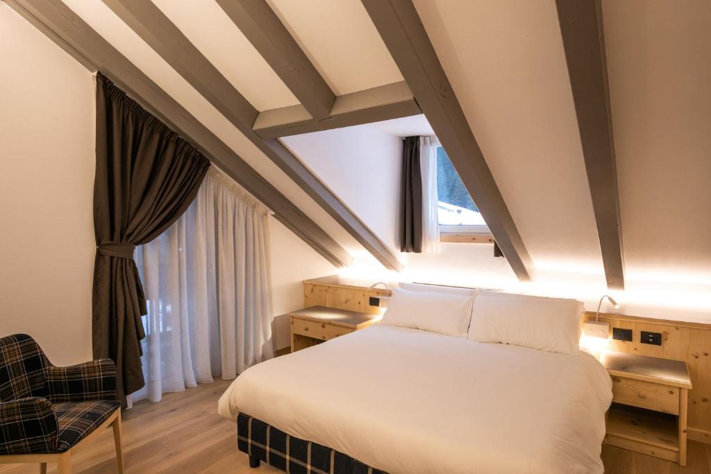 Posteľ alebo postele v izbe v ubytovaní Hotel Medil