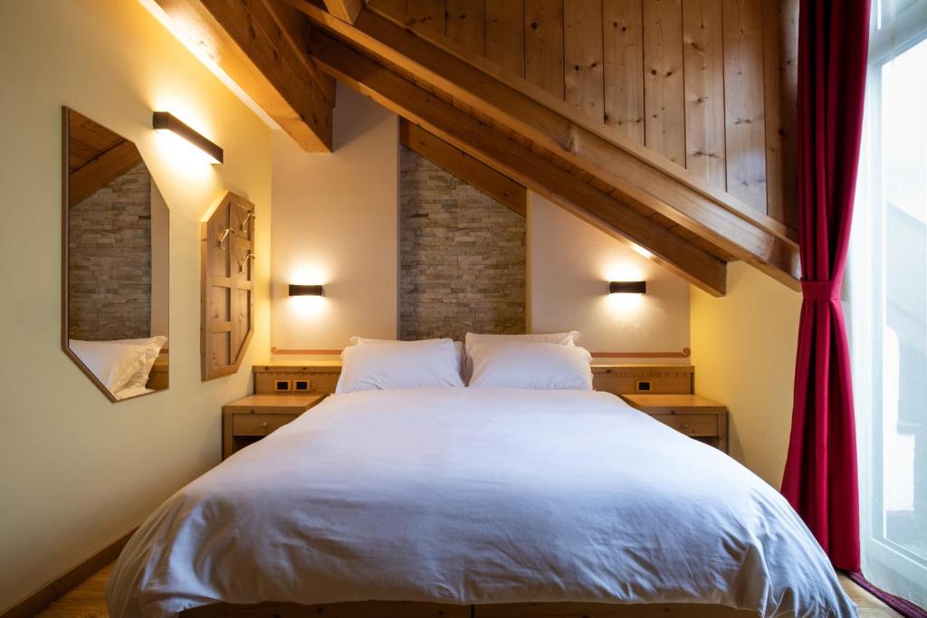 Posteľ alebo postele v izbe v ubytovaní Hotel Medil