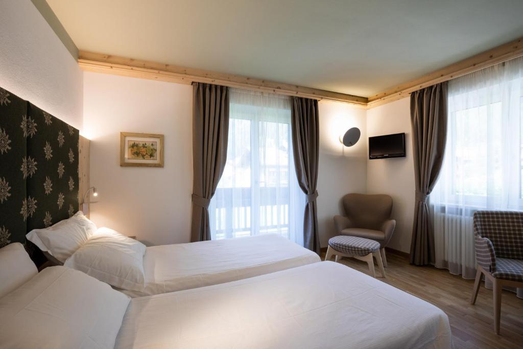 Posteľ alebo postele v izbe v ubytovaní Hotel Medil