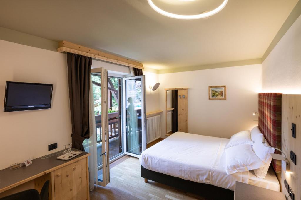 Posteľ alebo postele v izbe v ubytovaní Hotel Medil