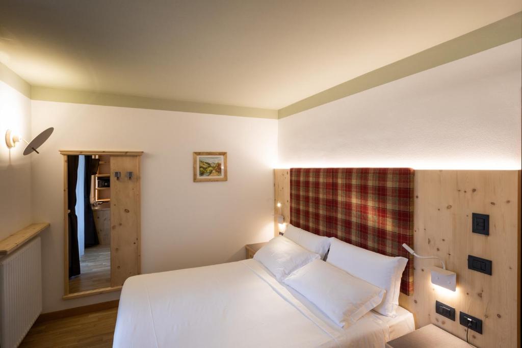 Posteľ alebo postele v izbe v ubytovaní Hotel Medil