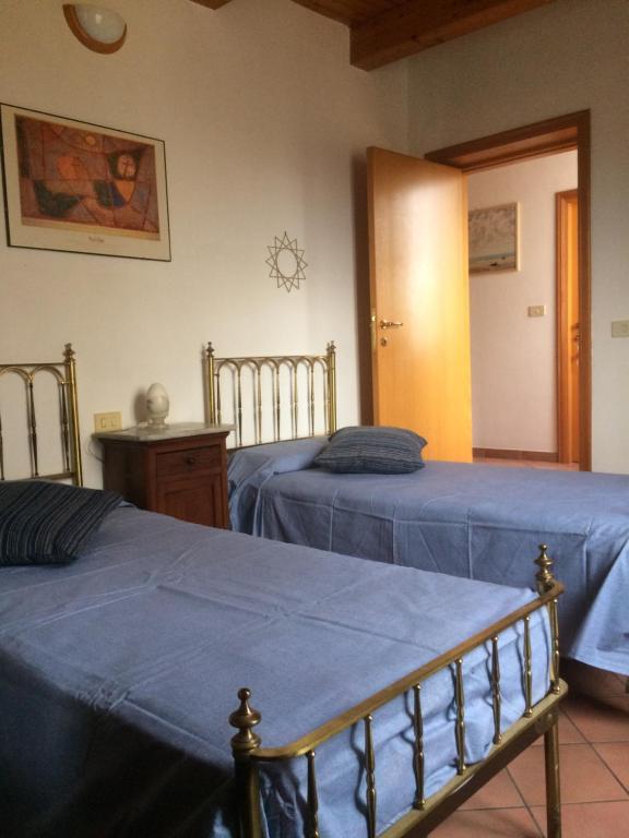 En eller flere senge i et værelse på Casa Calicanto