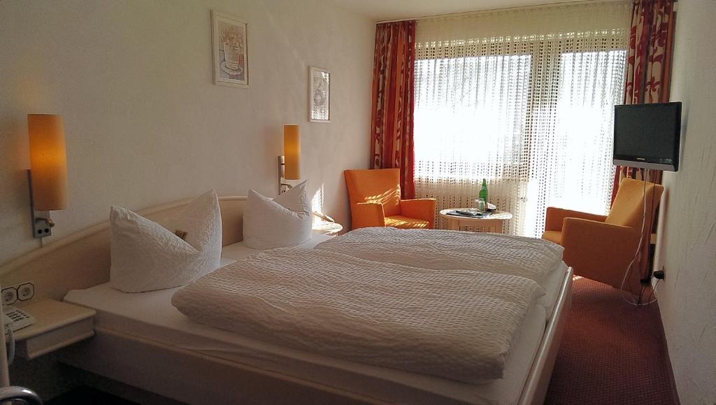 Postel nebo postele na pokoji v ubytování Hotel Magdalenenhof inklusive MeineCardPlus