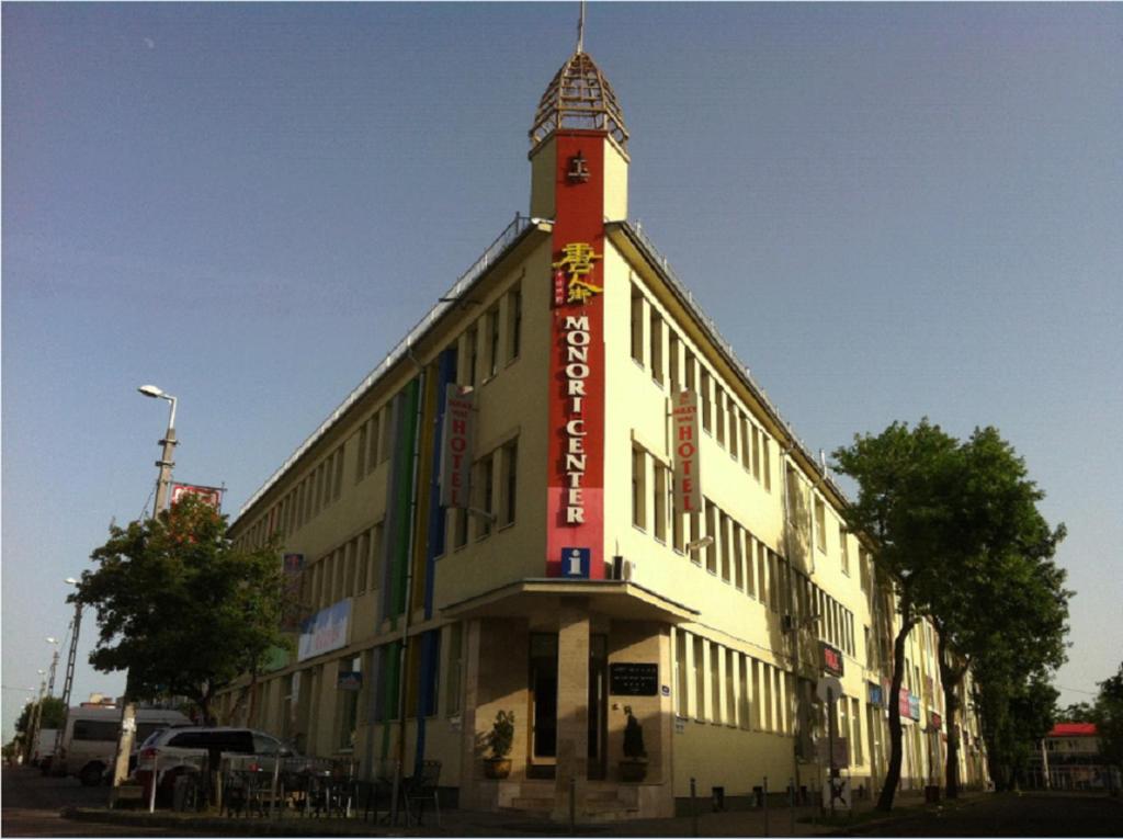 a building with a sign on the side of it at Milky Way Hotel in Budapest