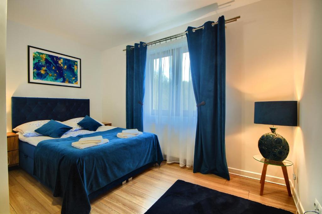 Posteľ alebo postele v izbe v ubytovaní Dom w Milówce - Apartamenty na Kowolu