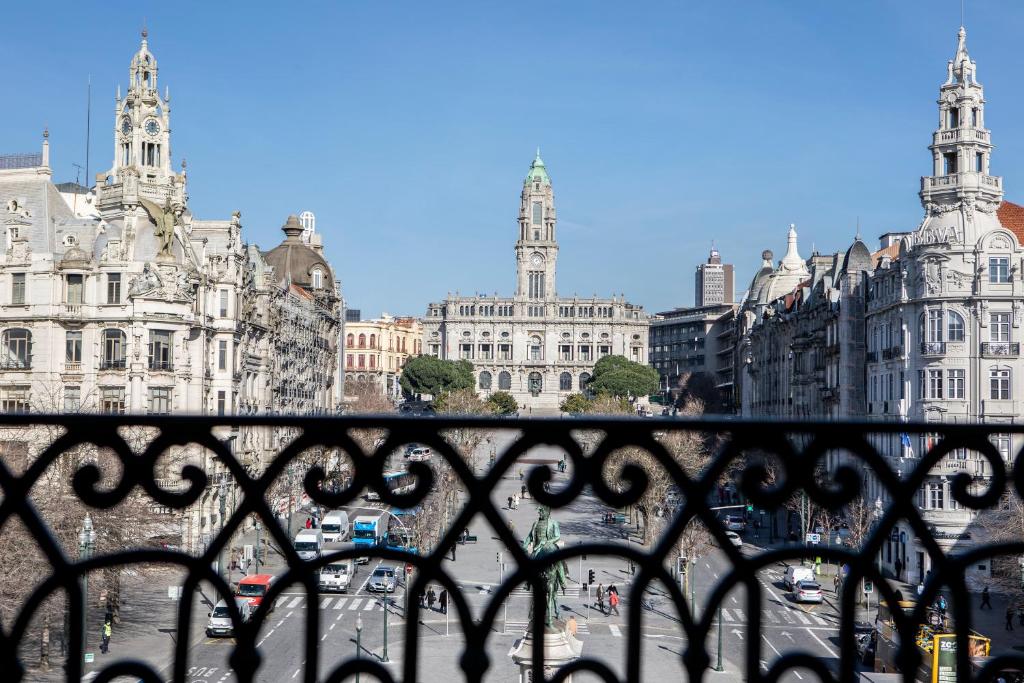 a view of a city from a balcony at InterContinental Porto - Palacio das Cardosas by IHG in Porto