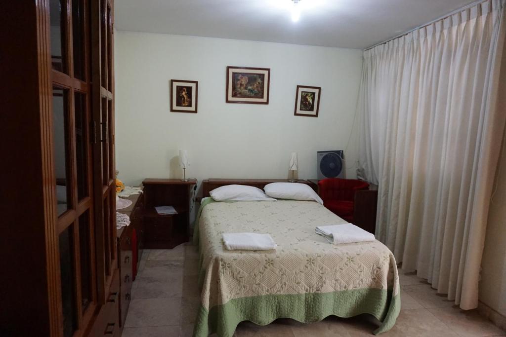 Postel nebo postele na pokoji v ubytování Hostal Camiluz