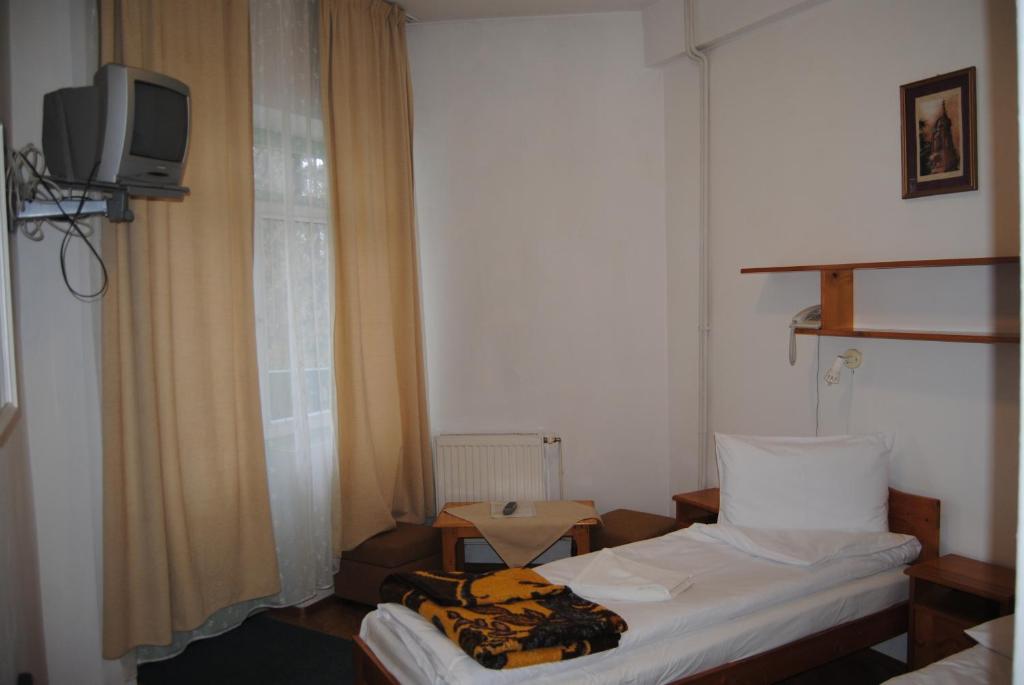 Postel nebo postele na pokoji v ubytování Hostel Teleki
