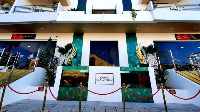 a building with a sign on the side of it at Kandi Palace in Angeles