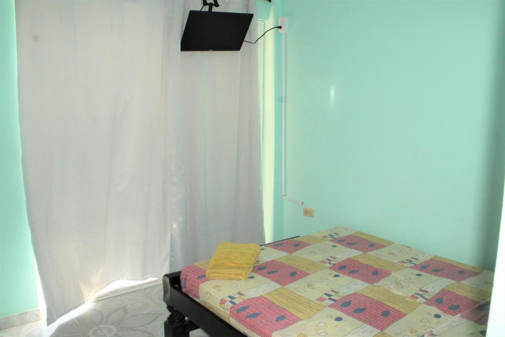 Postel nebo postele na pokoji v ubytování Posada Casamar2 alojamiento en San Andrés islas