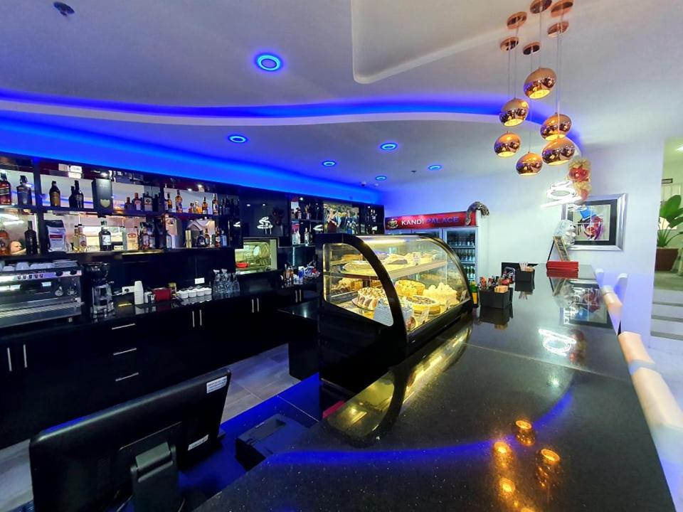 a bar with blue lights in a room at Kandi Palace in Angeles