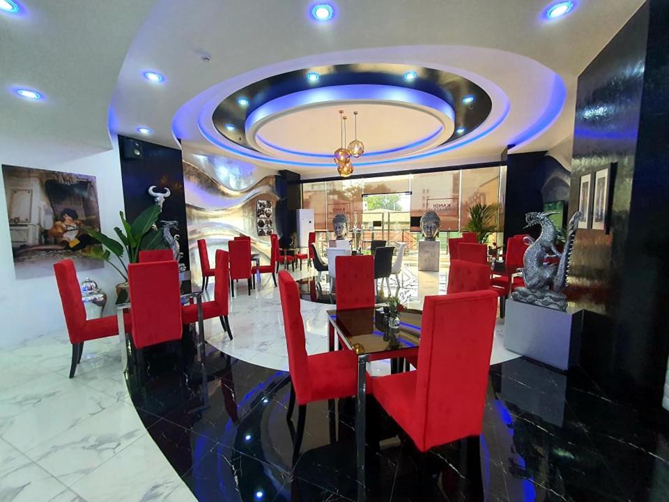 a restaurant with red chairs and a dining room at Kandi Palace in Angeles