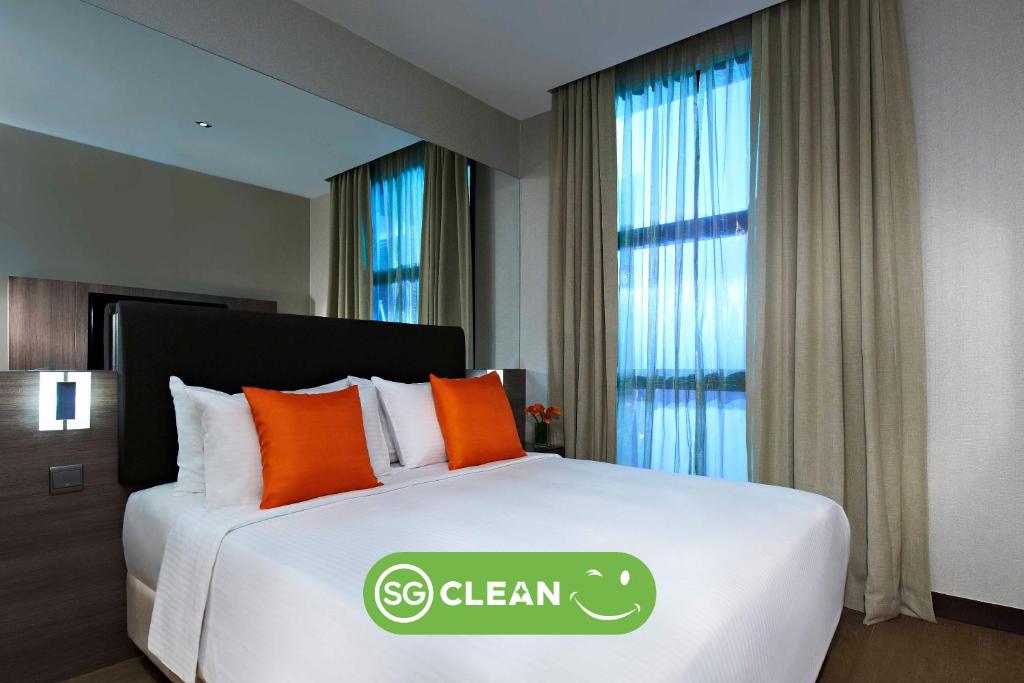 Cama o camas de una habitación en Aqueen Hotel Kitchener
