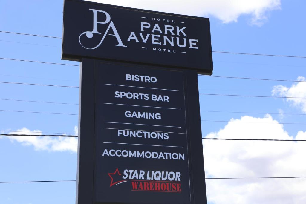 a sign for a park avenue sign for a sports bar at Park Avenue Hotel Motel in Rockhampton