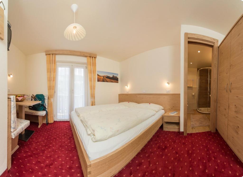 Postel nebo postele na pokoji v ubytování Kedul Lodge