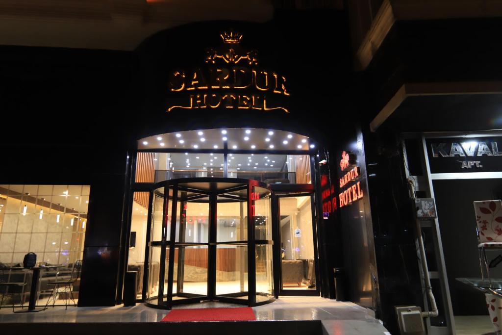 a front door of a store with a sign on it at SARDUR HOTEL in Bostaniçi