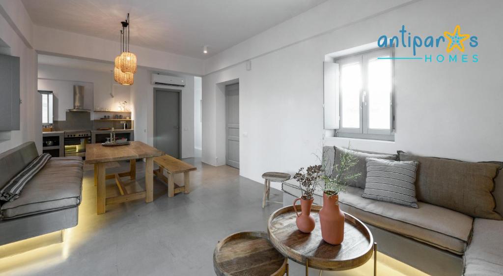 a living room with a couch and a table at Antiparos Homes in Antiparos