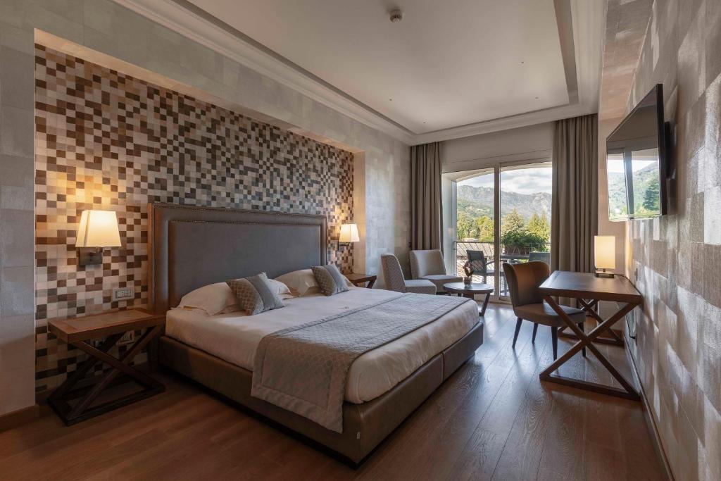 Postel nebo postele na pokoji v ubytování Hotel La Palma