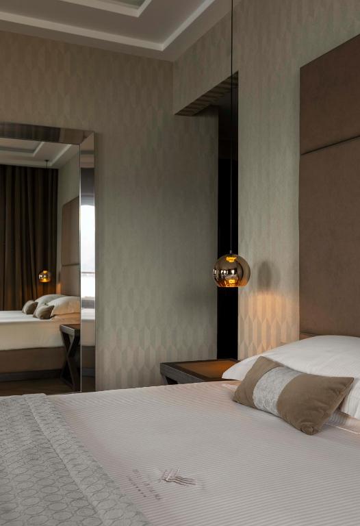 Postel nebo postele na pokoji v ubytování Hotel La Palma